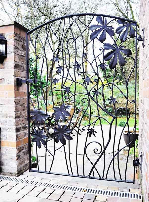 15 Decorative Metal Gate Design for Amazing First Impression metal garden gates design ideas wrought iron gate leaves pattern 15 Decorative Metal Gate Design for Amazing First Impression