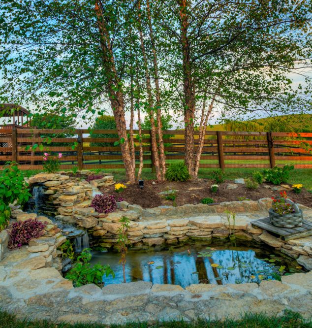 The Most Fanciful Backyard Water Features Ideas beautiful backyard water feature pond with waterfall 634x666 The Most Fanciful Backyard Water Features Ideas