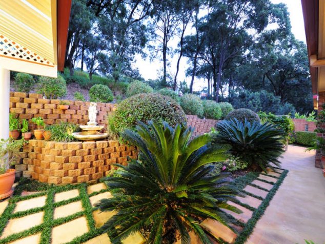 Landscaped Brick Wall Garden Design 634x476 Nice Collection of Bricks Garden Ideas