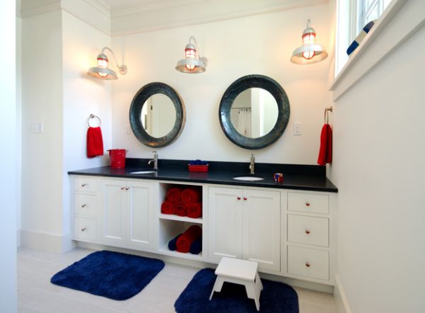 Red and blue towels help bring in the Nautical theme in the bathroom 15 of The Most Creative Bathroom Towel Storage