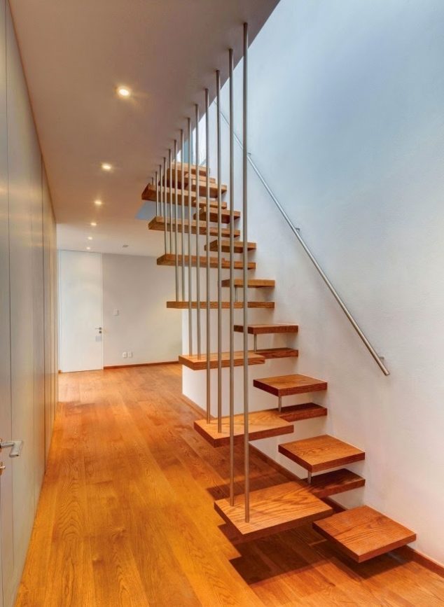 interior stairs design modern wooden stair design with metal handrail 634x867 15 Eye Catching Stairways to Charm You